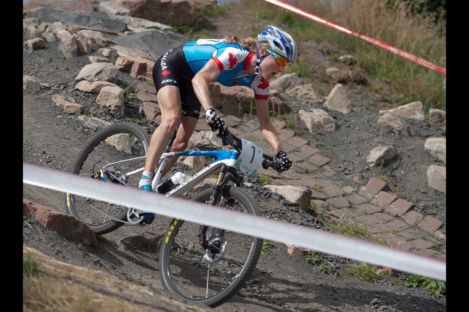 Canada's Catharine Pendrel races to gold in the women's cross-country event at Cathkin Braes mountain bike trails at the Commonwealth Games in Glasgow, Scotland on Tuesday.