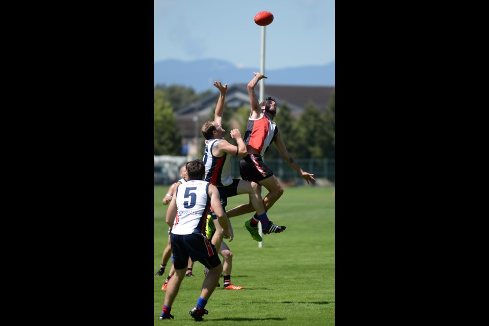 Australian Football League grand final, between the Cougars and West Coast Saints at Burnaby Lake sports complex.