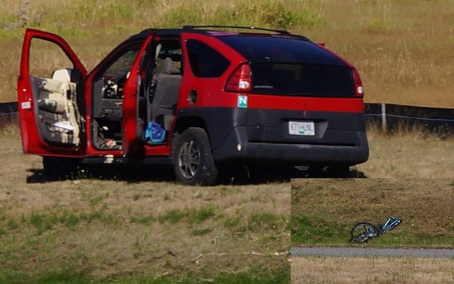 A driver of a Pontiac Aztec lost control of his/her vehicle and struck a cyclist on Russ Baker Way, killing the woman in her 30s. The inset shows the bike in pieces, not far away from the car.