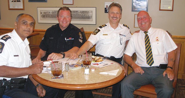 Legion first vice-president Trevor Castle is pictured with members of the Delta Police Department.