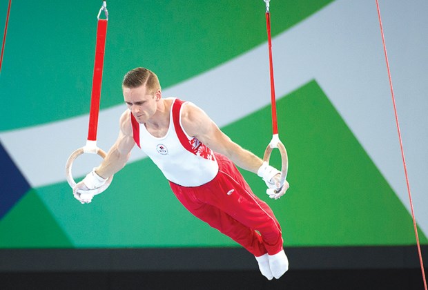 North Vancouver's Scott Morgan shows his strength during his rings routine at the Commonwealth Games last week in Glasgow, Scotland. Morgan won four medals, including gold in rings and vault.