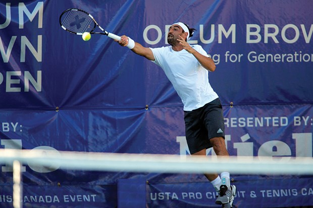 Marcos Baghdatis of Cyprus stretches for a forehand against Farrukh Dustov in the VanOpen final held Sunday at Hollyburn Country Club. The former world No. 8 won his second VanOpen title.