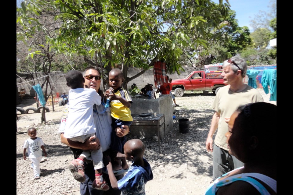 Pascal Courtemanche, left, a Quebec police officer working with the United Nations, helps an orphanage in Haiti, along with Dan Reynolds, a retired Langford building inspector.