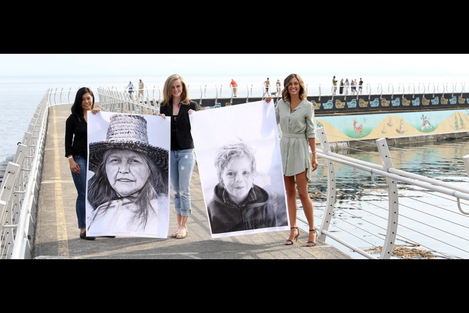 Sheila Alonzo, left, and fellow co-ordinators of the Inside Out Project Victoria Pam Lewis, centre and Britt Buntain will hang 225 portraits along the Ogden Point breakwater Saturday as part of the Integrate Arts Festival.