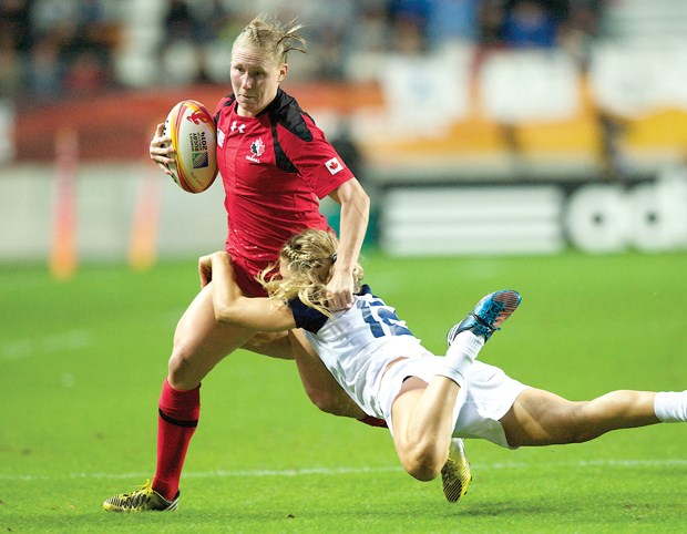 Mandy Marchak shakes a defender in a recent Women's Rugby World Cup game. Marchak and fellow Capilano Rugby Club members Hilary Leith and Andrea Burk will battle in the World Cup final Sunday against England.