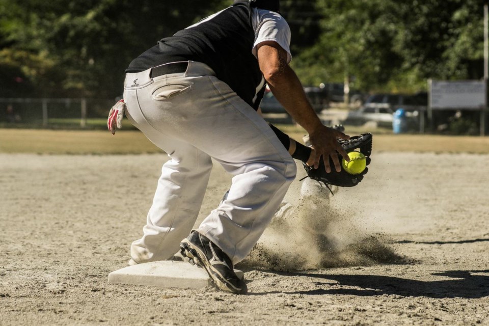 Shaker Mike Vertlieb, on base, holds the ball in his glove in an attempt to out a runner from the Brewers in one of this weekend’s semifinal game. The runner was called safe.