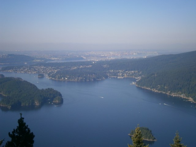 Looking west across Indian Arm from Vista No. 1 along the Diez Vistas Trail, hikers can see Deep Cove nestled along the shoreline and downtown Vancouver in the background.