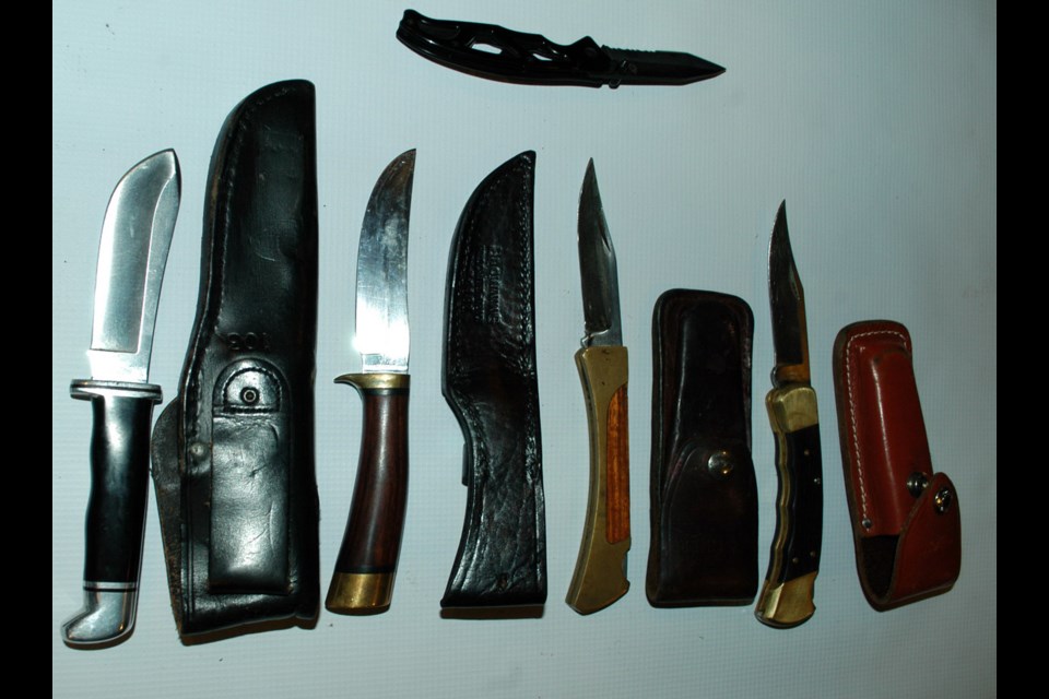 Seized: Police from Burnaby and New Westminster seized a considerable cache of items from a home on Sixth Street Aug. 14, including knives, a stun gun, several coin collections, and 10 swords.