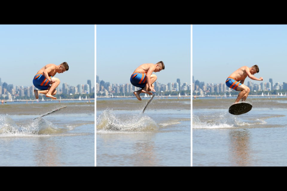 Skimboarder Dylan Maranda, 20, plays in the water at Spanish Banks.