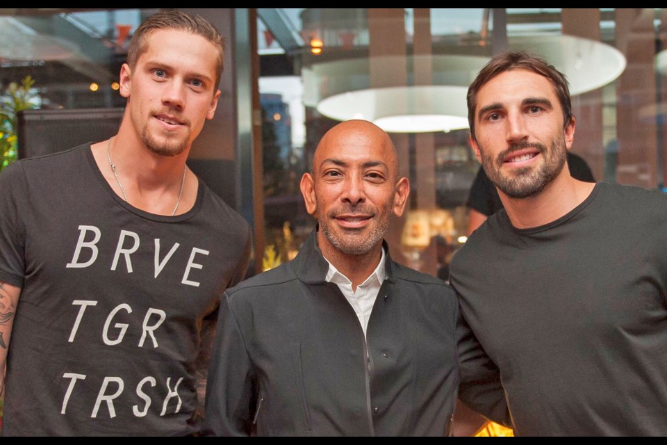 Felix Del Toro, head of Lululemon's menswear division (centre), welcomed hockey players Jason Garrison, right, and Vancouver Canucks goalie Jacob Markstrom to the opening celebrations.