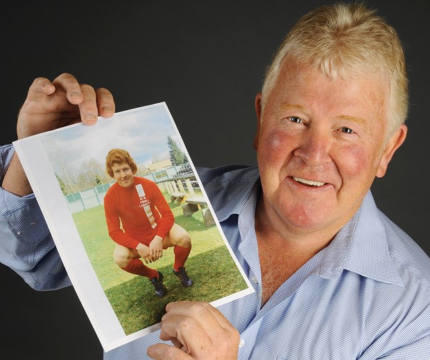 Chris Bennett holds up a photo from his playing days as a 17-year-old with North Shore United. Bennett began his soccer career in North Vancouver and his 50 years of playing and coaching success has landed him a spot in the Canadian Soccer Hall of Fame's class of 2014.