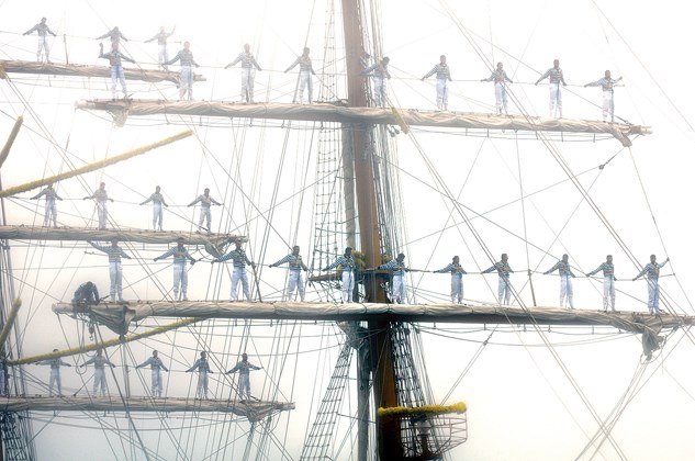 Mexican naval cadets stand abreast on the Cuauhtémoc's yards as it docks at the Burrard Pier in North Vancouver.