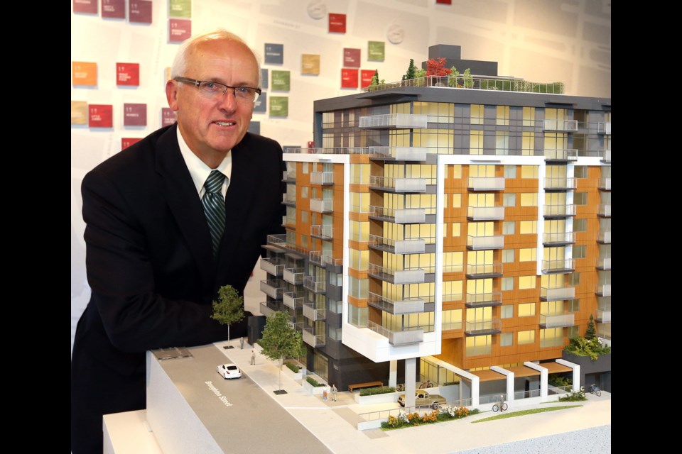 Wednesday: Developer David Chard shows a model of the new Escher development on Broughton Street. The project, named for the European graphic artist M.C. Escher, went on the market last week.