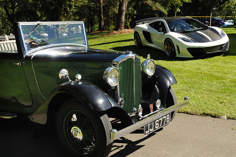 The Luxury & Supercar Weekend at VanDusen Botanical Garden showcased more than $100 million worth of cars, trucks and boats, including this (foreground) 1933 Rover Tickford Drophead 10, one of only six on the planet. This modified white McLaren MP4-12C (background) was also a popular draw for luxury car enthusiasts. Photo: Dan Toulgoet