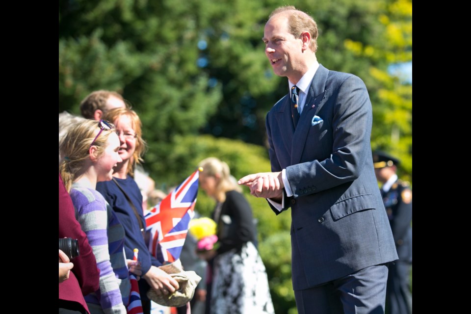 Prince Edward greets the welcoming crowd at Government House in Victoria on Friday. Sept. 12, 2014