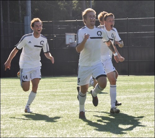 Quest's Max Tagesen (middle) celebrates with his teammates after scoring the go ahead goal against Langara on Sunday (Sept. 14).