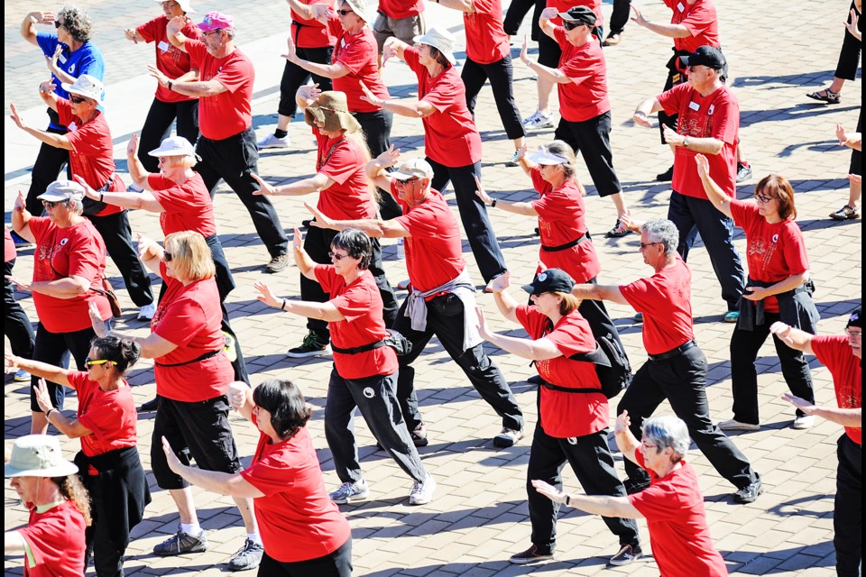 More than 300 practitioners in Fung Loy Kok Taoist tai chi took place in a 15-minute long set of 108 moves as part of the Taoist Tai Chi Society’s international awareness day at Jack Poole Plaza this past Saturday. Photograph by: Rebecca Blissett