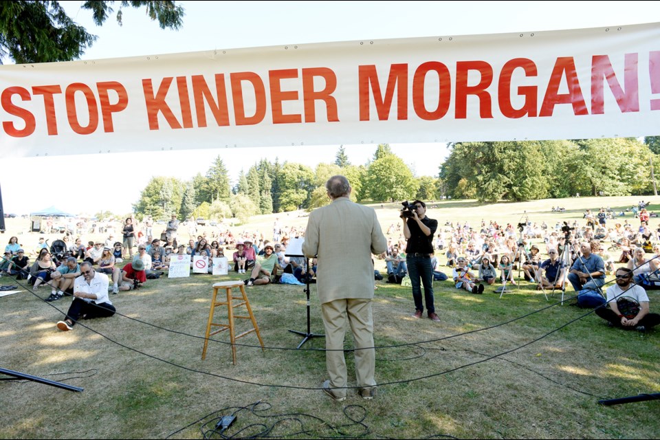 Mayor Derek Corrigan addresses the crowd at the anti-pipeline rally on Burnaby Mountain on Saturday.