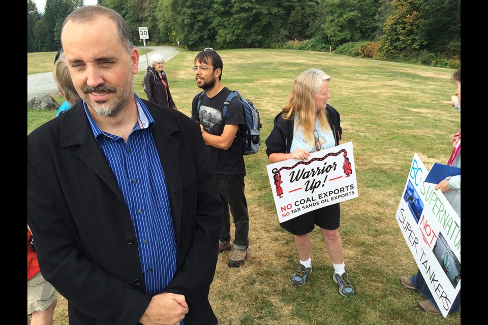 Cutline: SFU English professor Stephen Collis says residents are planning to take turns keeping watch on Burnaby Mountain, and if Kinder Morgan returns to continue survey work, they will stop the company with their bodies.