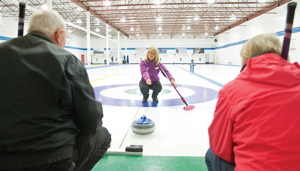 Sandra MacKinnion (centre) teaches Bill and Susan Jackson of Ladner the basics of curling at one of the Tunnel Town Curling Club’s Learn to Curl sessions at the South Delta Recreation Centre.