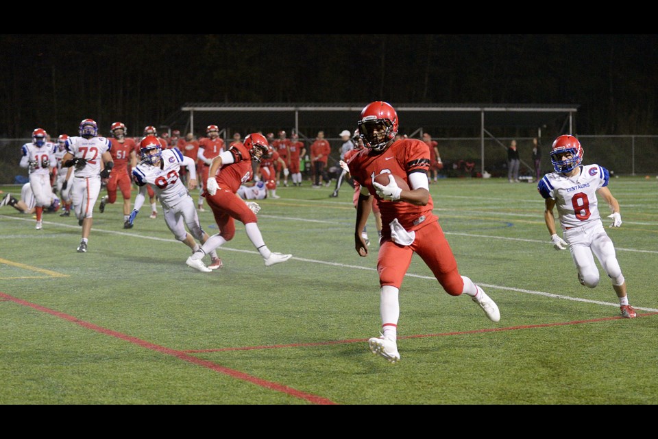 St. Thomas More Knights in action in the Sept. 19 homecoming game at Burnaby Lake against Coquitlam’s Centennial. The Knights won 42-0.