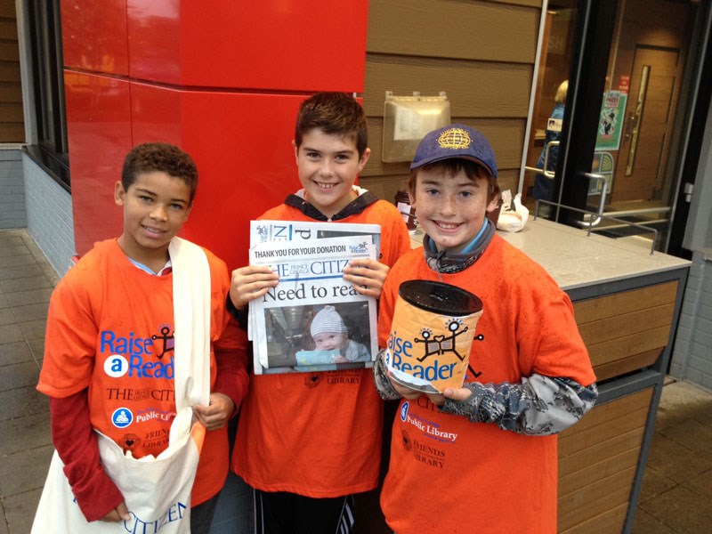 Students from St. Mary's school volunteer to accept donations for Raise a Reader in exchange for a special edition Prince George Citizen at McDonald's on 15th Avenue this morning until 9 a.m.