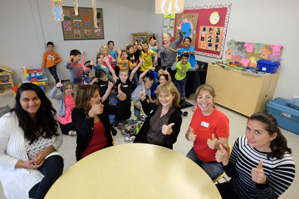 From left, Fareen Manji, Sandip Singh, Antonia Beck, Nazanin Ashjai and Gulgaz Asgarli are all excited for the official opening of the Gilpin daycare, which took place Wednesday.