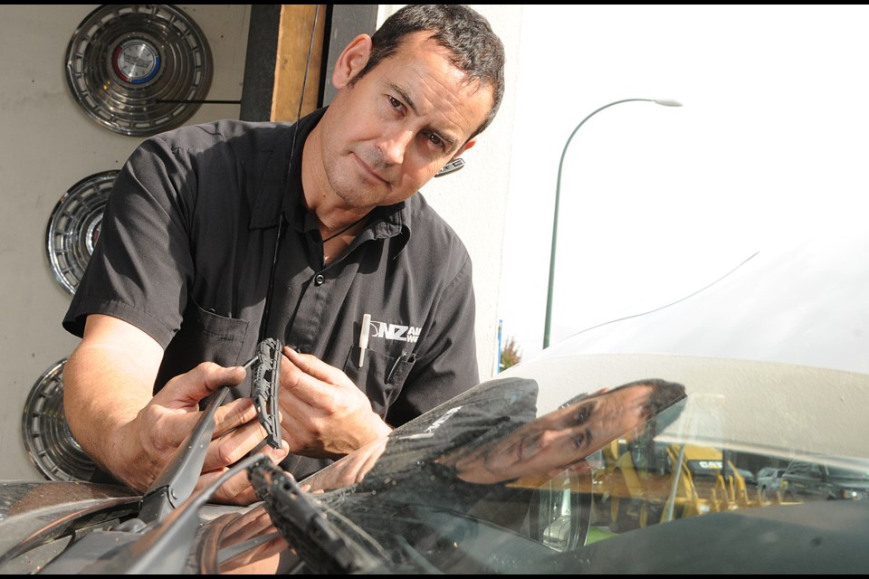 Craig Bidlake, of NZ Auto Works, says worn windshield wipers should be replaced prior to winter driving. photo Dan Toulgoet