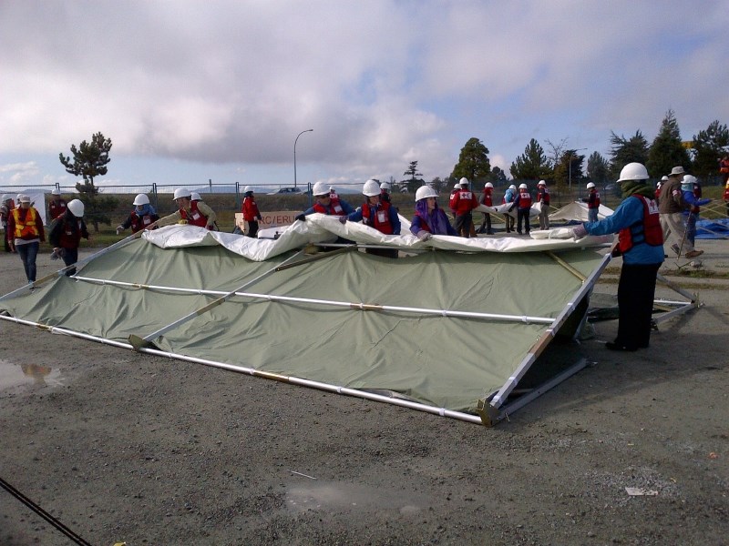 Disaster training participants set up tents for a field hospital in Sidney. September 2014