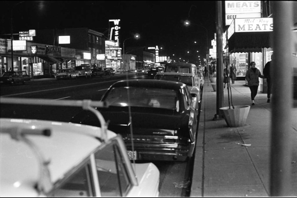 Hastings Street in 1968, looking east from Gilmore Avenue. Signs for Wosk’s and the Admiral Hotel are visible across the street.