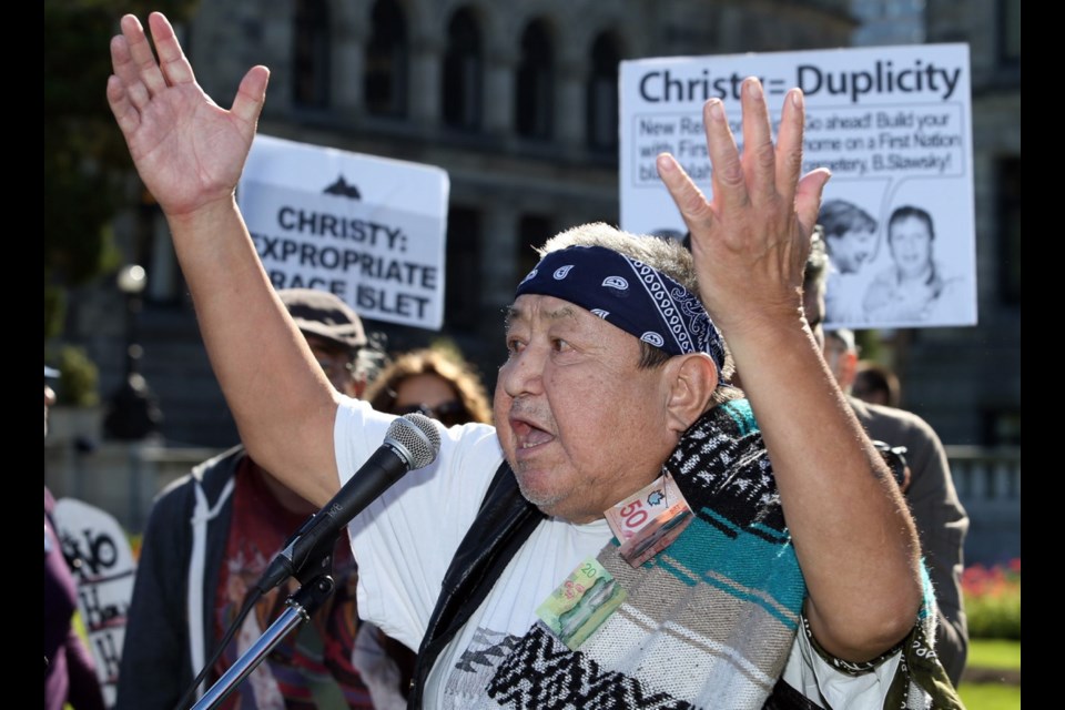 Willie Seymour speaks at a demonstration on the grounds of the legislature, held to coincide with the opening of the fall session on Monday. Protesters were rallying against construction of a luxury home over a First Nations burial ground on Grace Islet.