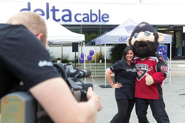 Host Iayisha Khan had fun with Jack the Giant during Delta TV Day at Delta Cable headquarters in Ladner Saturday. The event, which celebrated locally-produced TV programming, saw guests tour the studio and meet local personalities.