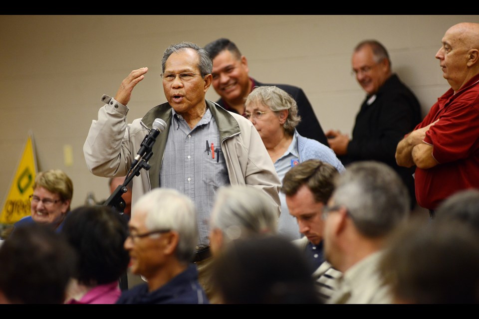 Resident Nelson Didulo speaks at an all-candidates meeting at Killarney Community Centre Wednesday night. Photo: Dan Toulgoet