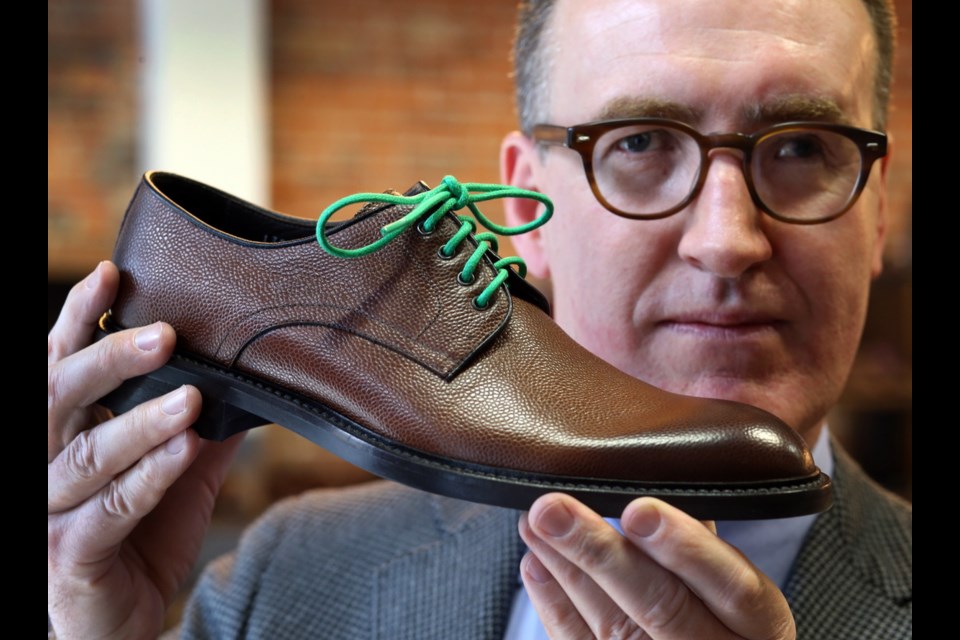 Dale Olsen, owner of Outlooks for Men on Yates Street, says coloured laces are a fun way to liven up a look and donÕt have to be co-ordinated with the rest of an ensemble.