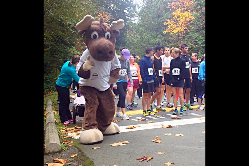 B.C. Parks mascot Jerry the Moose loosening up before last year&rsquo;s Goldstream Salmon Run.