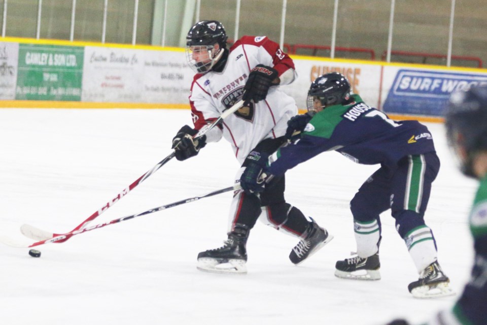 The Giants' Carter Stephenson keeps control of the puck during Sunday's (Oct. 12) game versus the Fraser Valley Thunderbirds at the Burnaby Winter Club. The Giants left the ice with a 3-1 win.