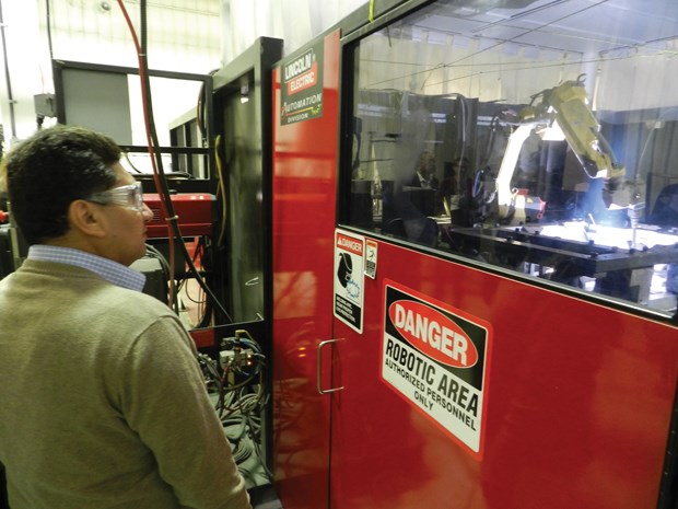Visitors to Ebco Industries Ltd. during Manufacturing Week in B.C. were treated to a peek at robotic welding equipment. Photo by Philip Raphael/Richmond News