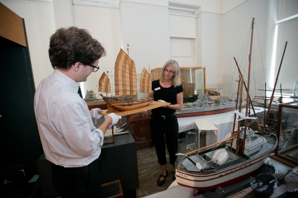 Wednesday: Bryan Smith and Anissa Paulsen carefully lift models of ships as the Maritime Museum of B.C. prepares to move to its new home in the CPR building.
