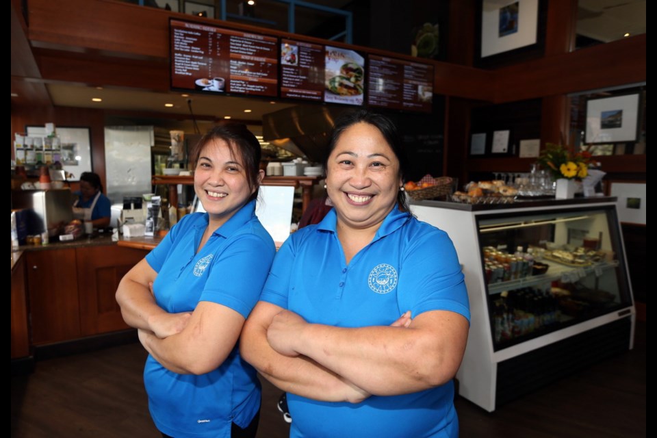 Tess Hrominchuk, right, works with her partner and sister Anna Dupitas in their restaurant, the Aegean Cafe, which recently moved into new, renovated space at the corner of Fort and Blanshard streets.