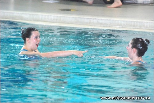 Ailsa Muir and Sadye Cable perform a duet routine during the Estevan Mermaids synchronized swimming club&#8217;s year-end water show Saturday at the Souris Valley Aquatic and Leisure Centre.