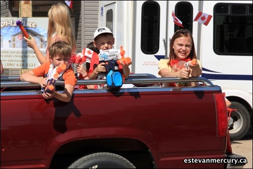 The Canada Day parade featured floats, water guns, candy tossed to the streets and lots of red and white.