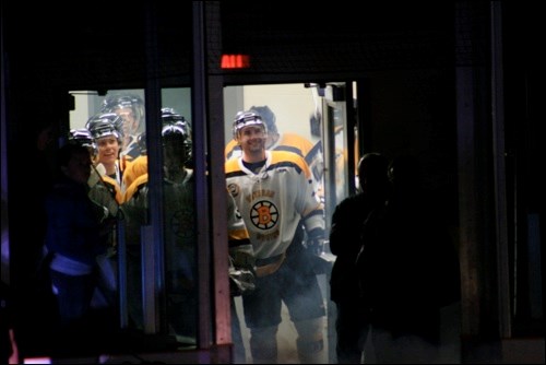 The Bruins wait to hit the ice before the pre-game ceremony.