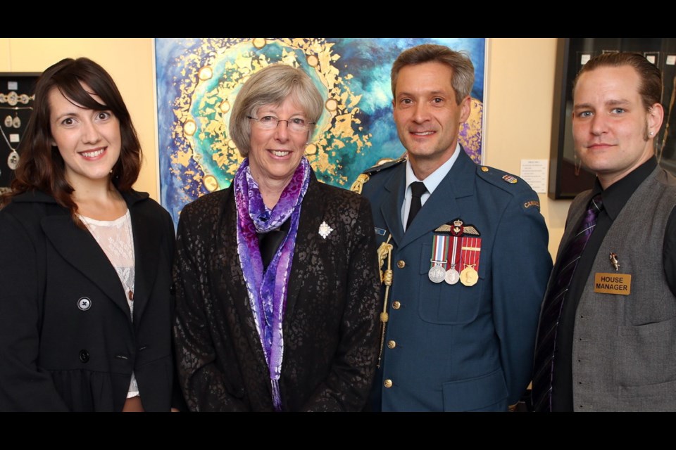 Heather Jarvie, left, and house manager Alex Carroll pose for a photograph with Lt.-Gov. Judith Guichon and her uniformed honorary aide-de-camp, Maj. Ross Campbell at a reception before Thursday night's performance.