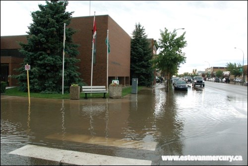 A portion of Fourth Street was flooded after an intense storm Thursday night in Estevan. An estimated one to two inches of rain was dumped on the city in half an hour, overwhelming storm sewers in the downtown core and leading to knee deep puddles in some areas.