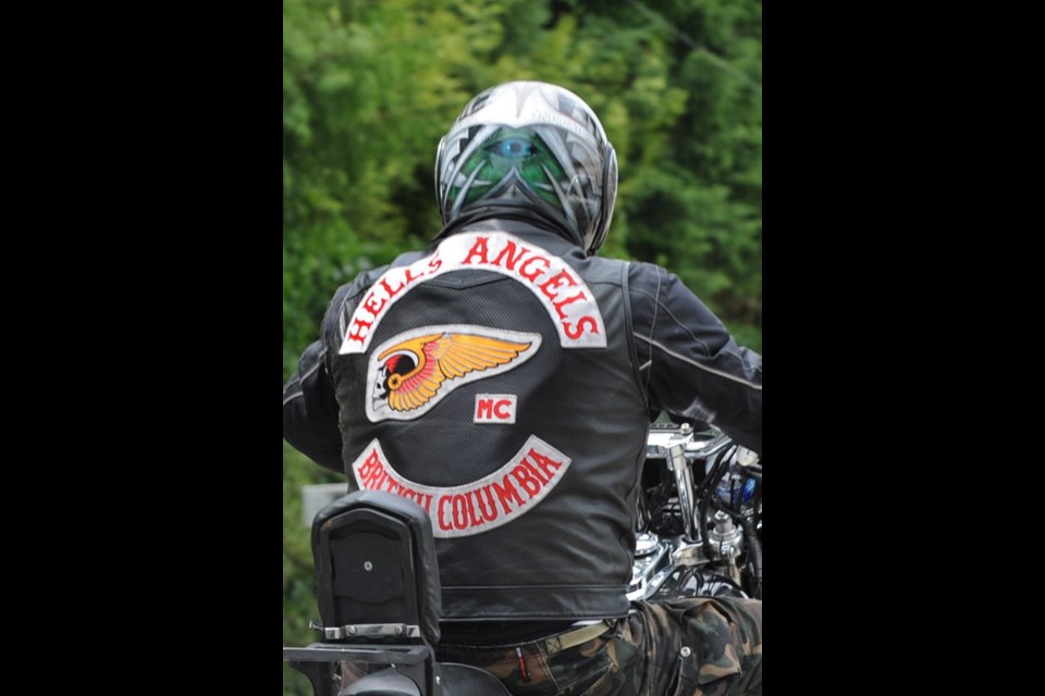 A Hells Angel says police overstepped their legal boundaries by stopping 150 members in North Cowichan in an effort to conduct document and safety checks