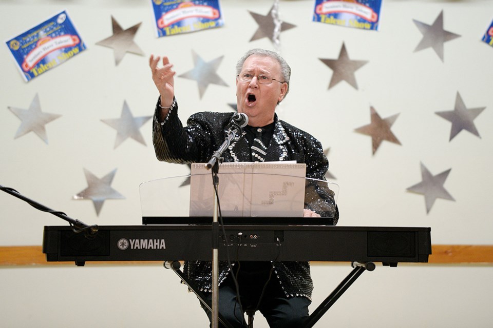 Dan Minor gives it his all during the second annual Seniors Have Talent show Hall on Sunday, Oct. 19.