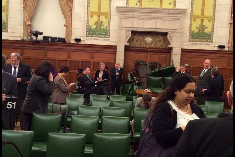 A photo by MP Nina Grewal shows MPs barricading themselves in a room on Parliament Hill in Ottawa.