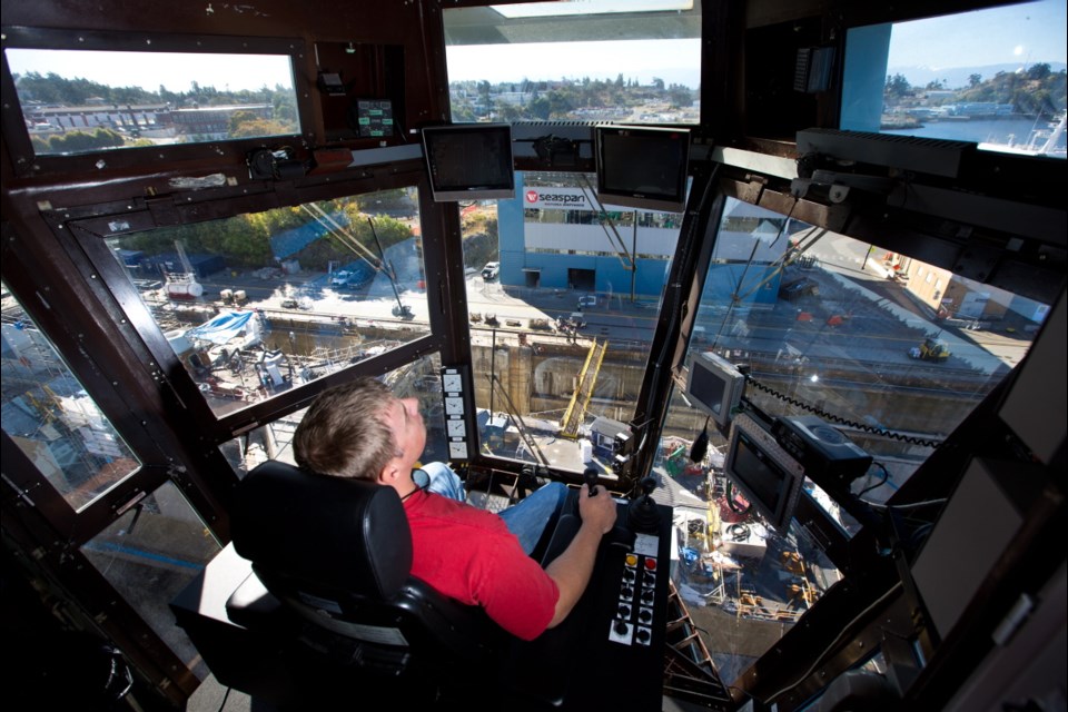 Crane operatorJohn Smith runs the the 27-tonne Ebco crane above HMCS Ottawa at Seaspan Victoria Shipyards in Victoria.