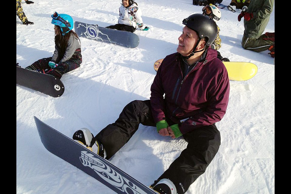 Steve Sxwithul’txw, the host of the television series Warrior Games, learned to snowboard alongside children at Whistler in February 2013.