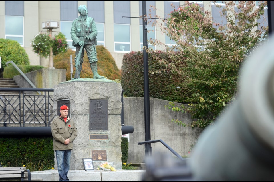 Veteran Wayne Laviolette keeps vigil at the New West cenotaph Friday in solidarity with active Canadian soldiers, targeted in two deadly attacks this week.